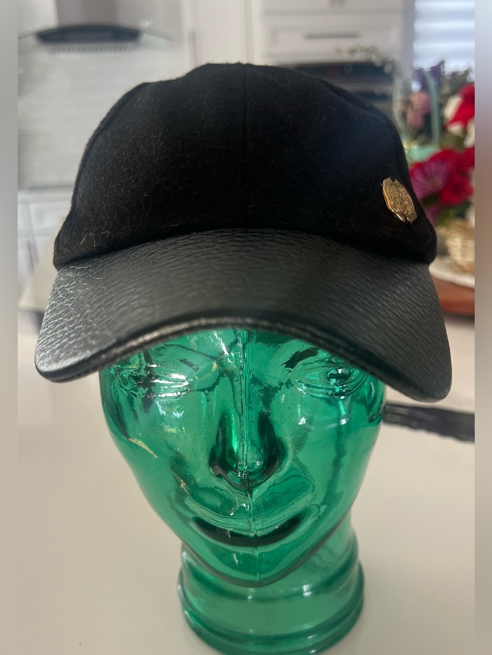 Vince Camuto Black Cap with Gold Crest Accent